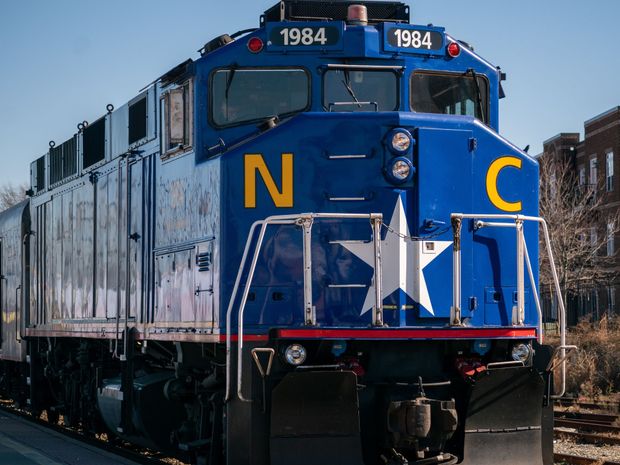 A blue train with the year 1964 on the front
