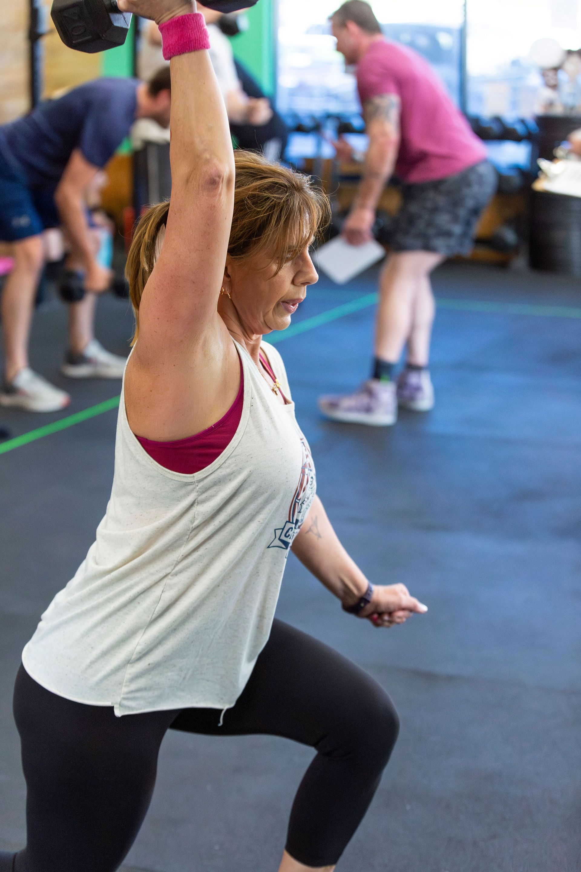 A woman is jumping over a box at CrossFit Montrose near Glendale, CA