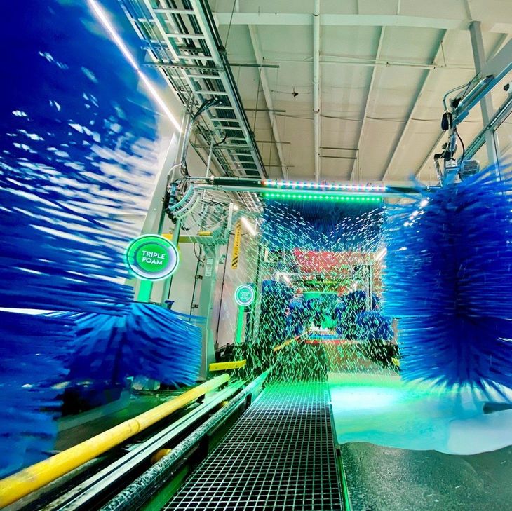 car wash with green lights and blue brushes