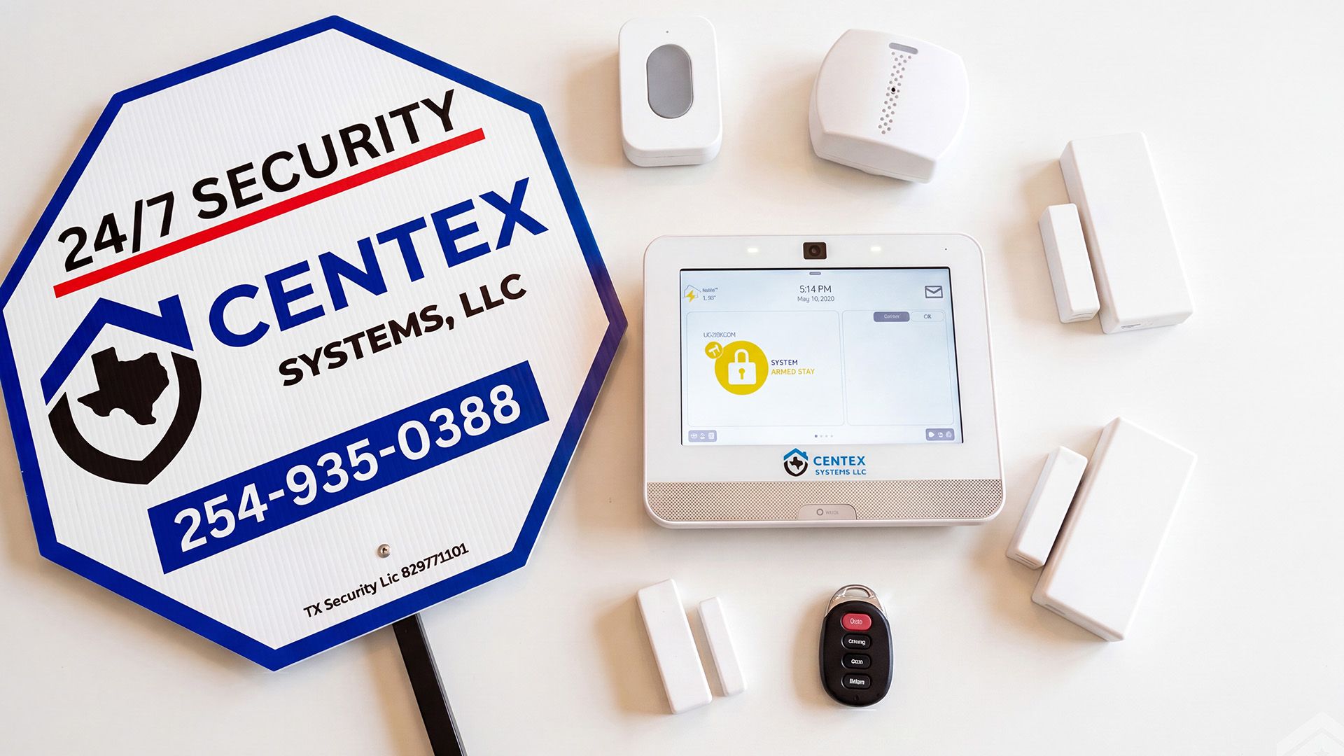 CENTEX Security Systems sign with home alarm keypad, sensors, and remote on a white background