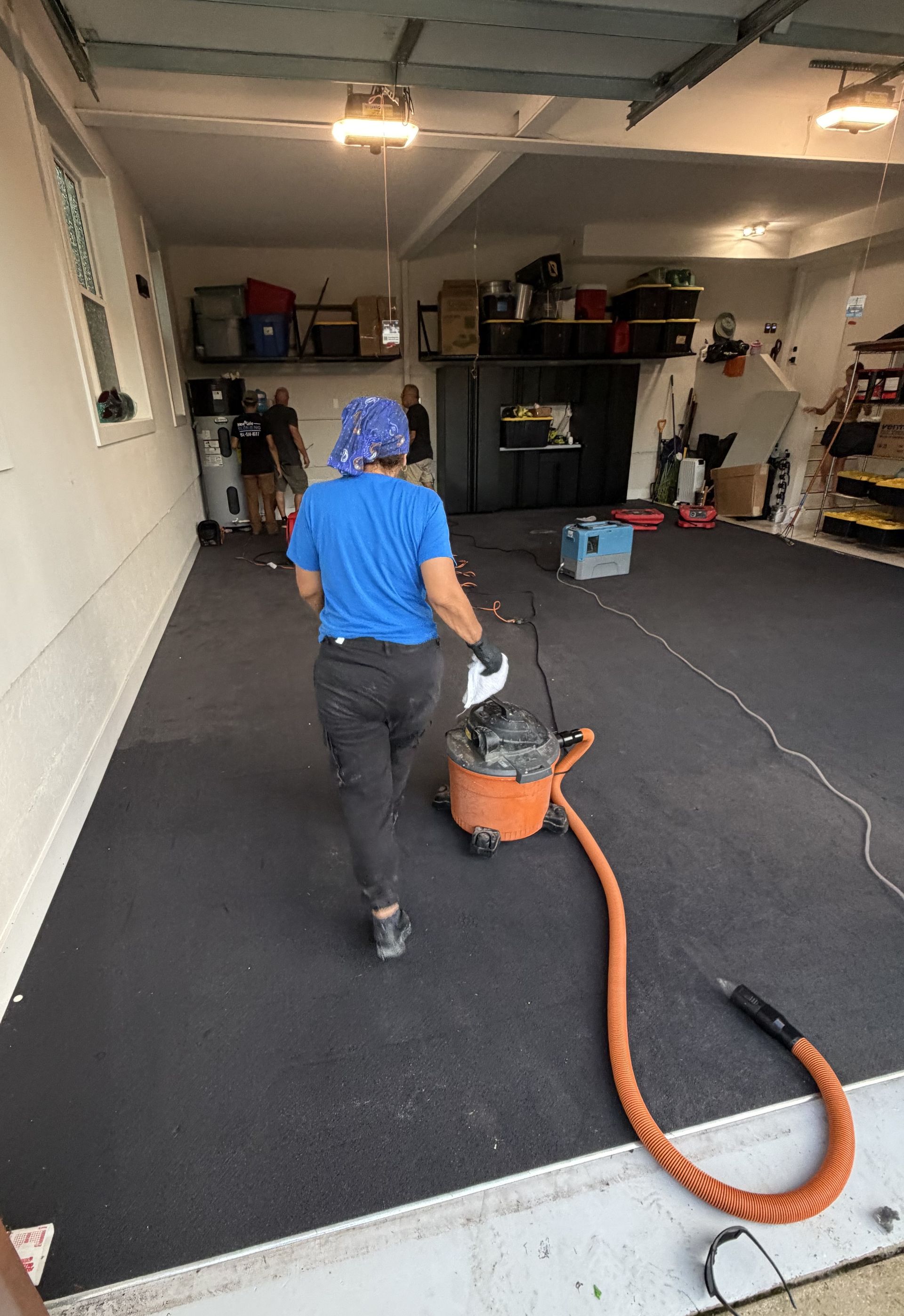 Acme technician with drying equipment for emergency flood call