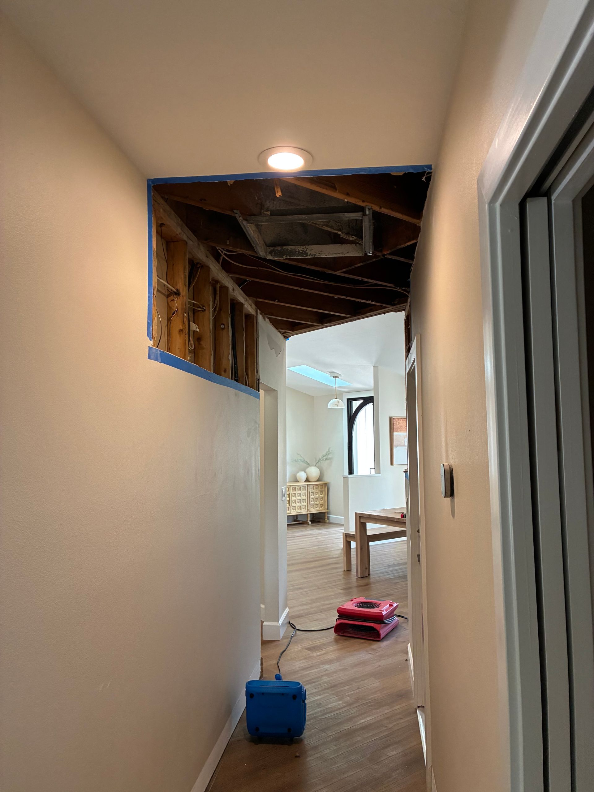 Opened ceiling and drying equipment during water damage mitigation on Siesta Key