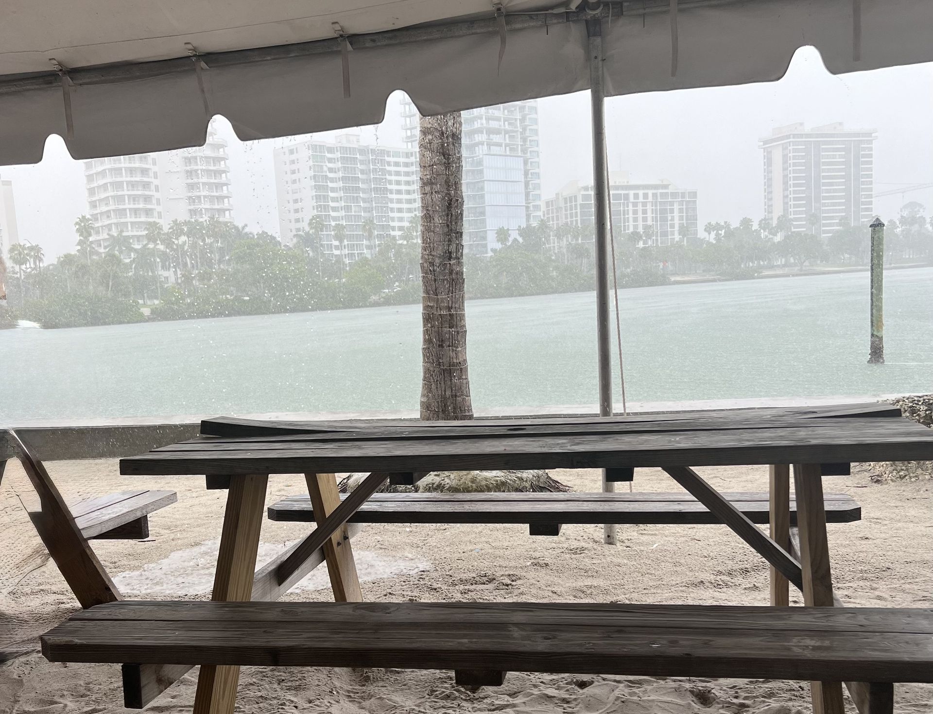 Heavy rain falling over Sarasota Bay during Florida’s rainy season.