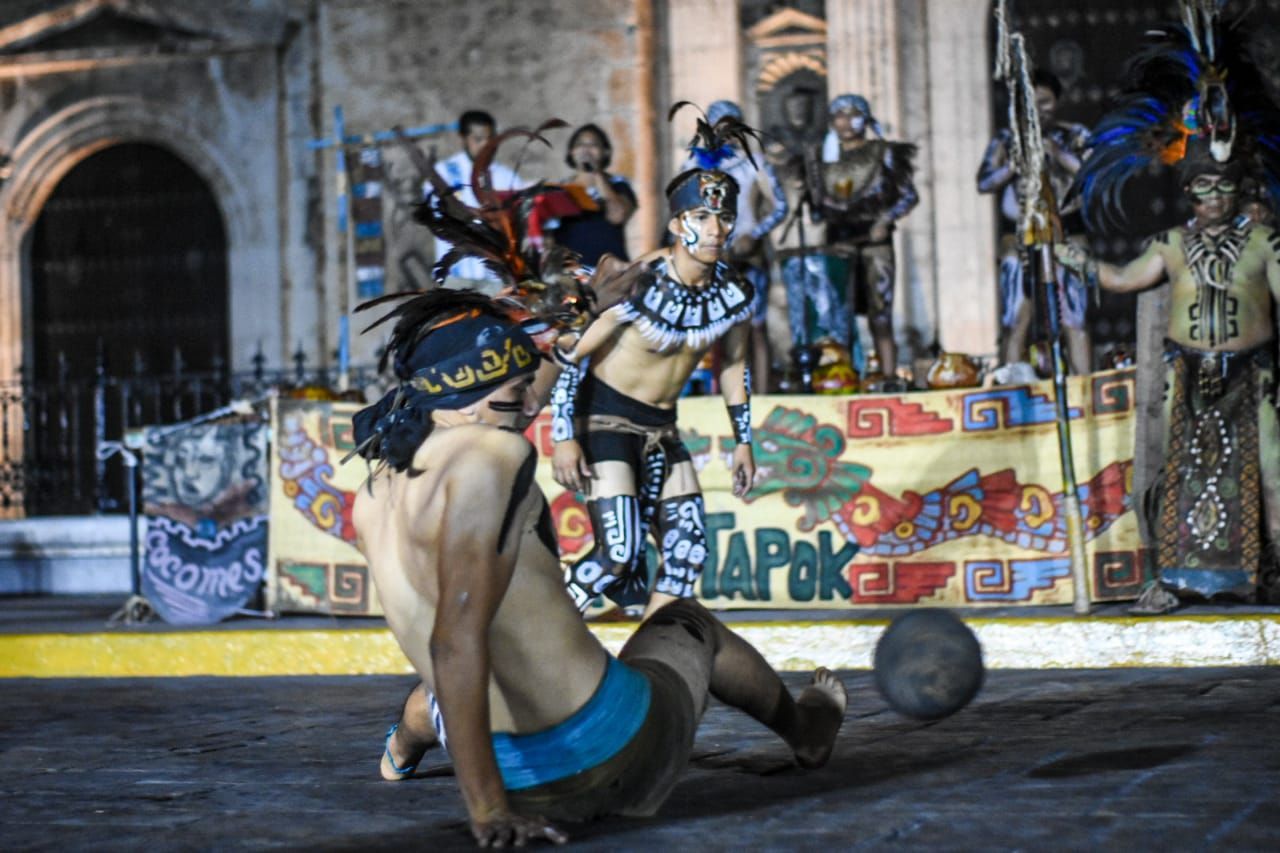 A group of people are playing a game of soccer on a stage.