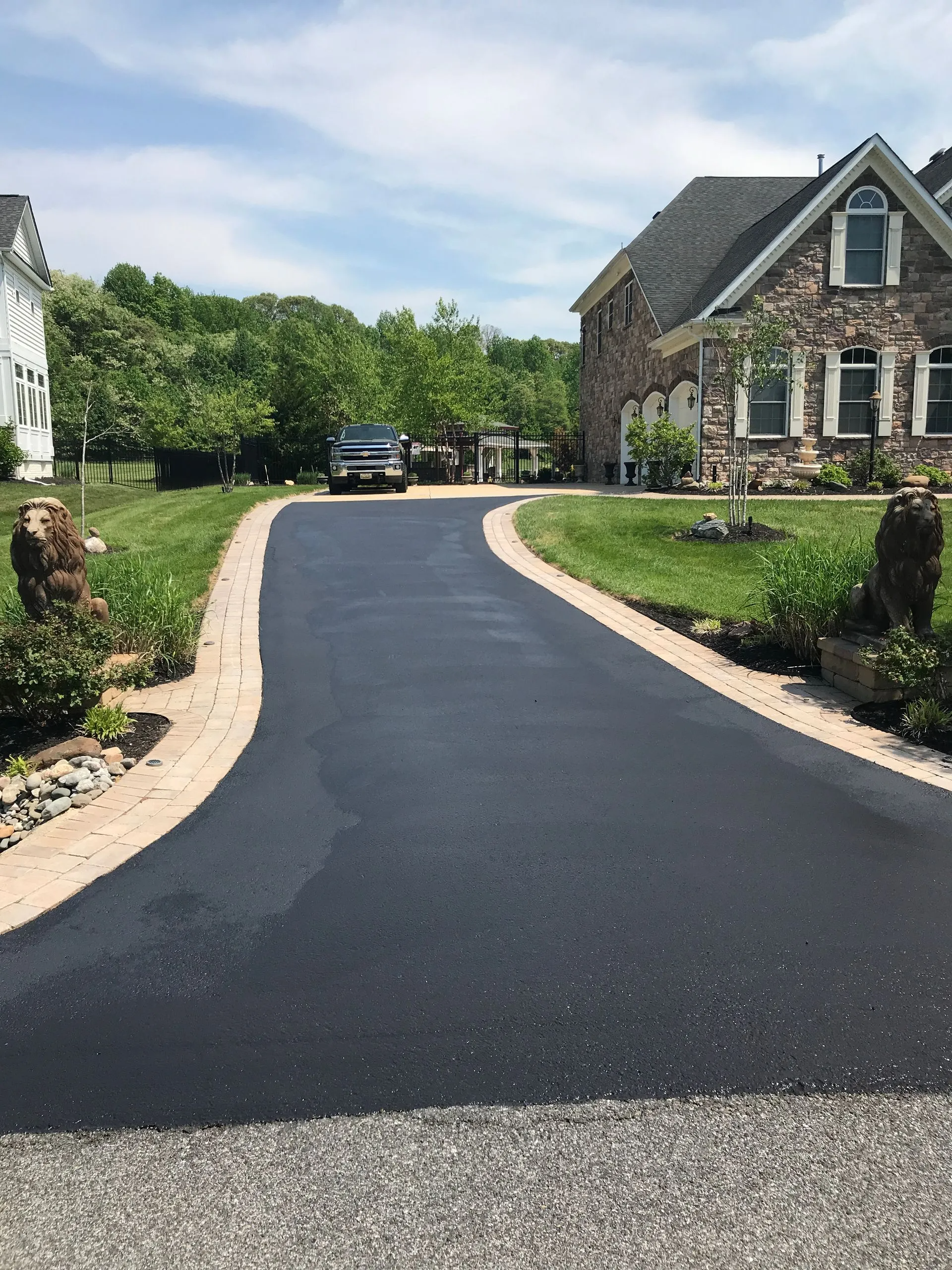 Freshly paved asphalt driveway at a residential home in Nashville TN