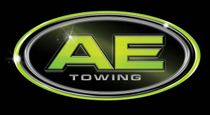 AE Towing logo with lime green “AE” on a black oval badge