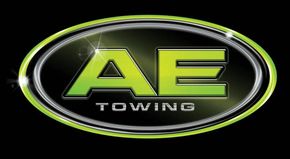 AE Towing logo with lime green “AE” on a black oval badge