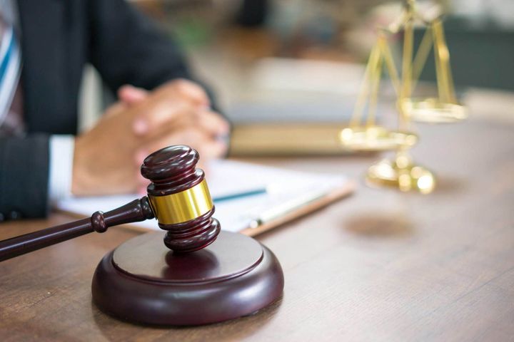 Lawyer with gavel and scales of justice on desk — Grand Prairie, TX — The Law Offices of Dapo Adebayo