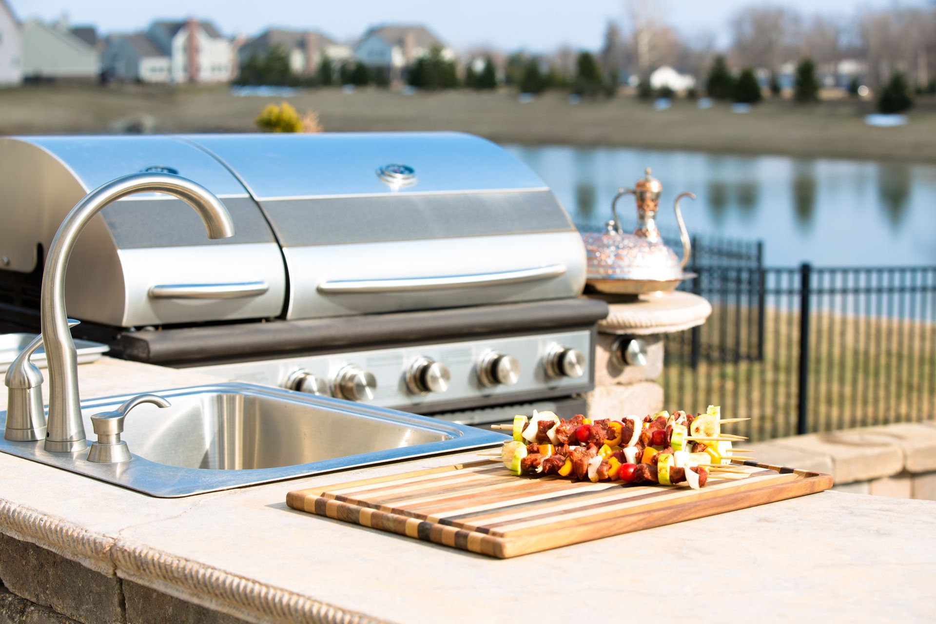 an outdoor summer kitchen alongside the gas BBQ ready
