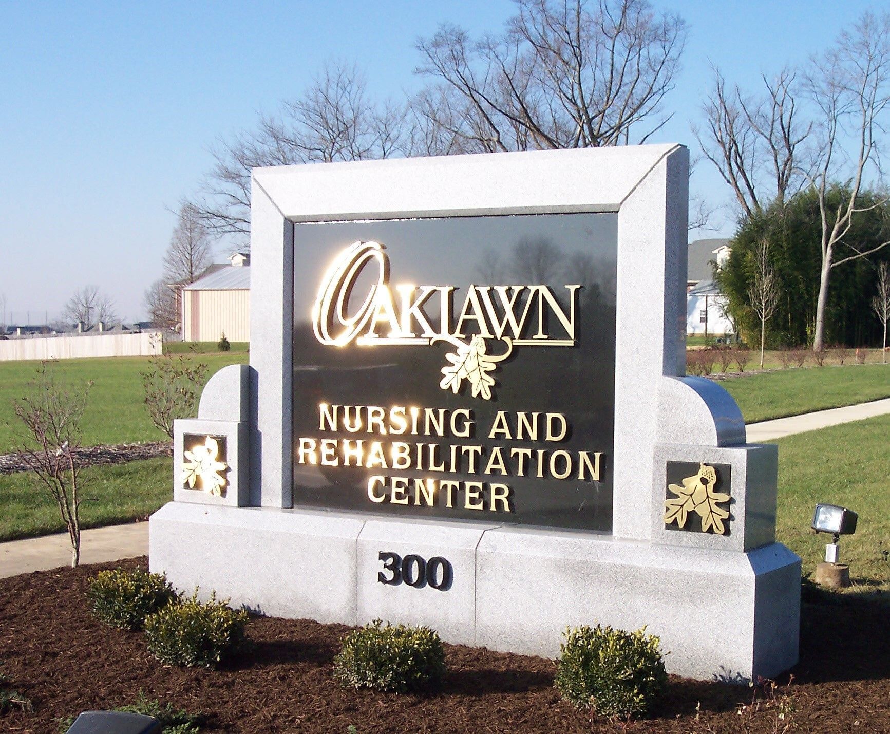 Oak Lawn Nursing and Rehabilitation Center sign in front of a building