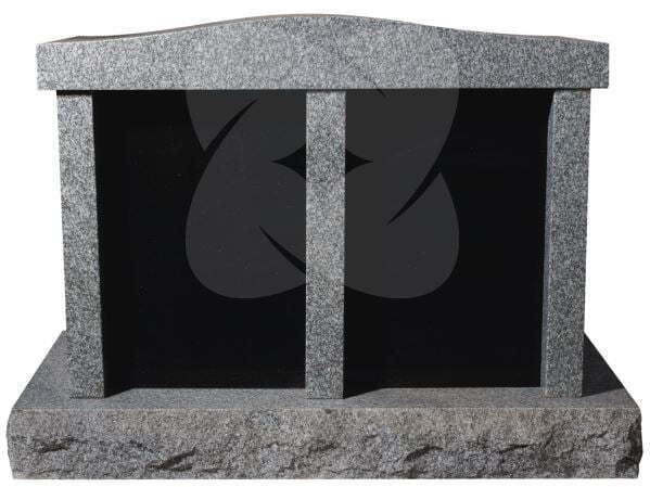 Gray stone fireplace with a black interior and vertical center divider, shown front view
