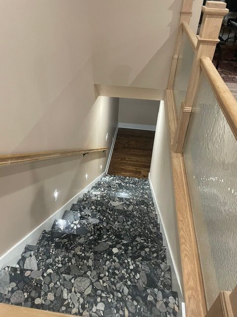 Stairwell with shattered glass covering the steps and landing