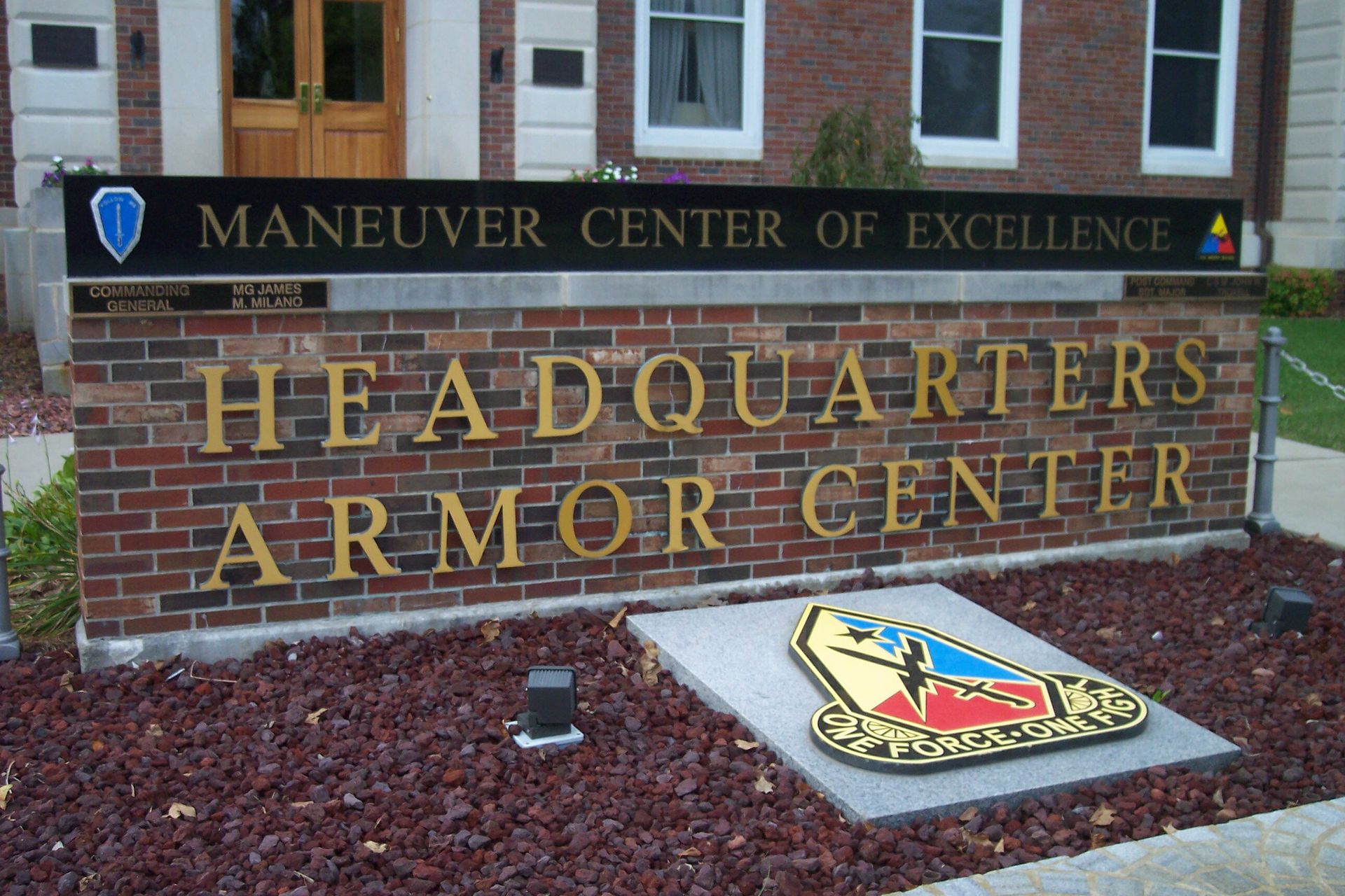 Brick sign reading “Headquarters Armor Center” at the Maneuver Center of Excellence.