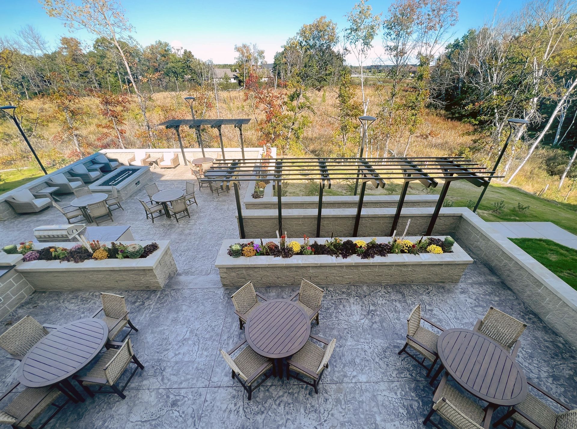 An aerial view of a patio with tables and chairs