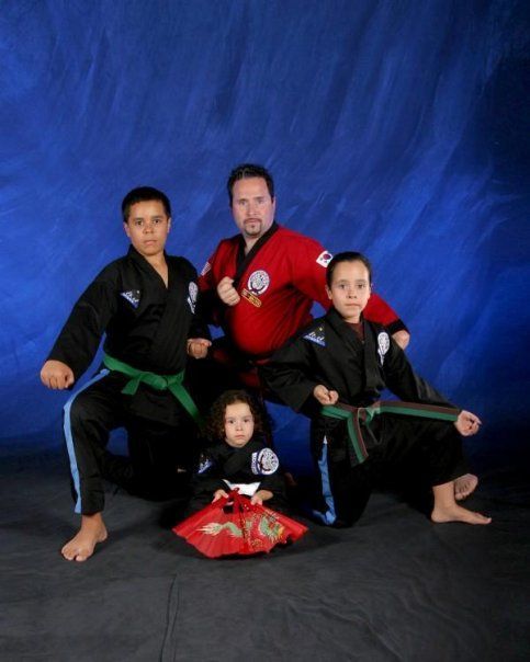 A group of martial arts fighters posing for a picture
