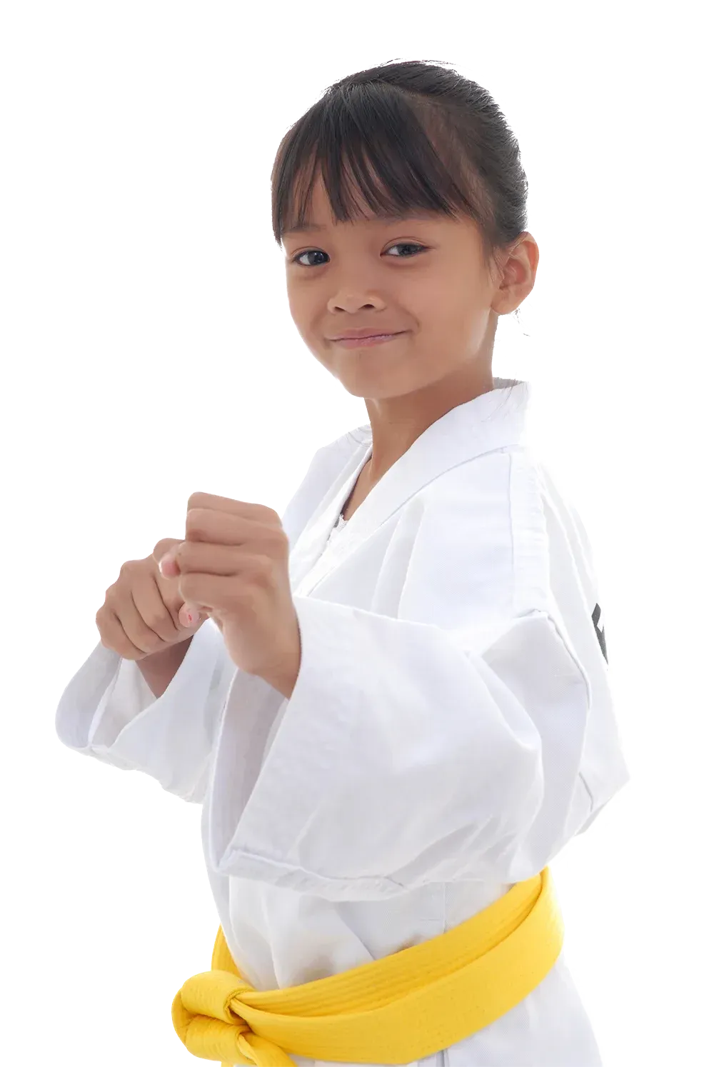 A young girl is wearing a white karate uniform and a yellow belt.