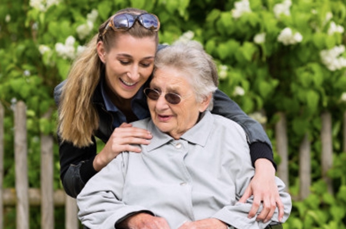 elderly woman with caregiver