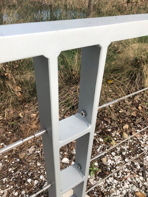 Industrial-style metal railing with a prominent post.