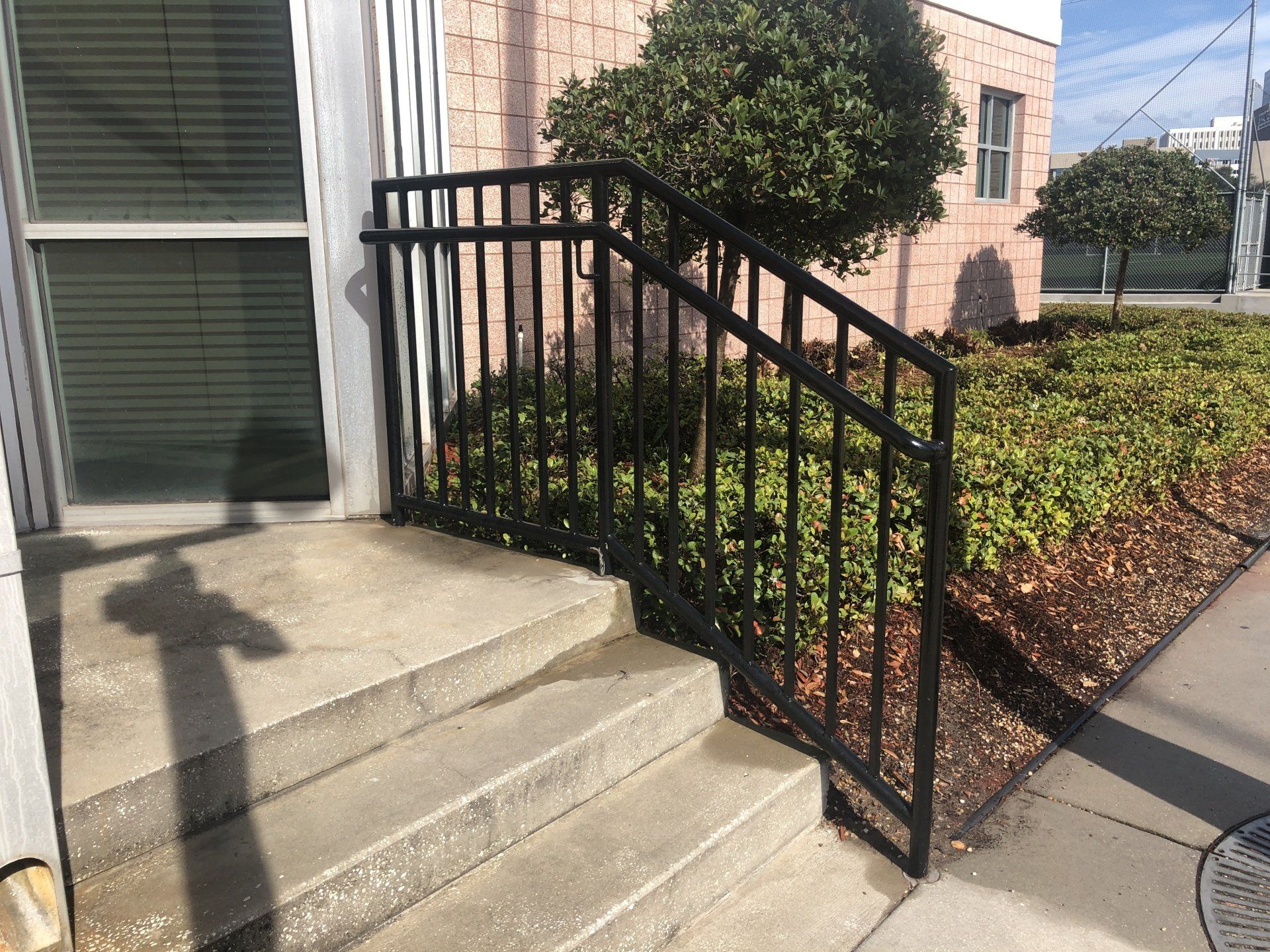school entrance staircase handrailing with powder-coated pipe railing