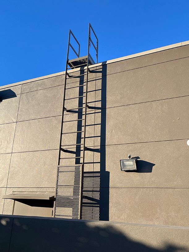 rear of retail location with ladder allowing easy access to roof