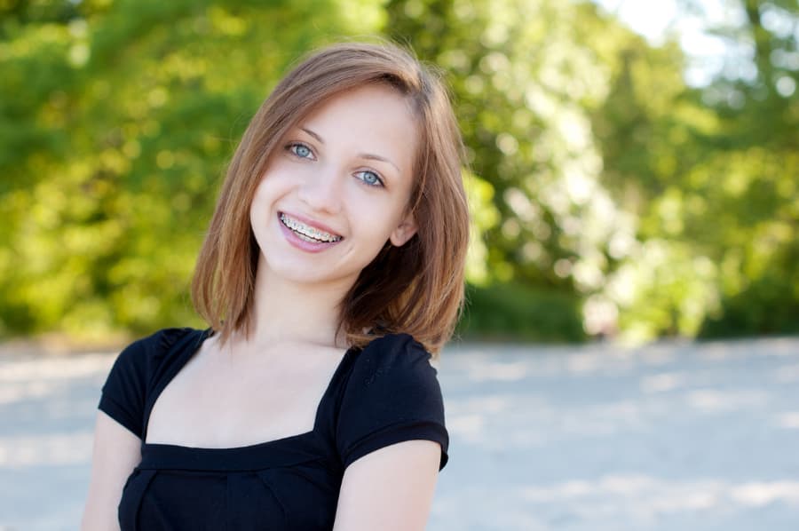 candid photo of beautiful woman wearing braces
