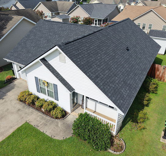 Long-lasting metal roof offering potential savings on repairs and replacement costs for a home in Perry, GA.