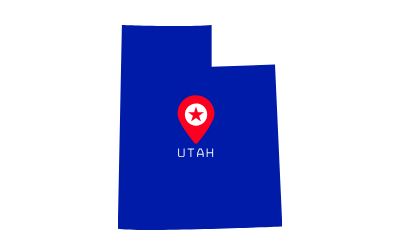 Blue outline map of Utah with a red location pin and the word “UTAH” underneath