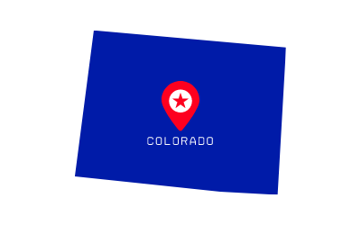 Blue Colorado state flag with a red-and-white emblem and the word “COLORADO” centered.