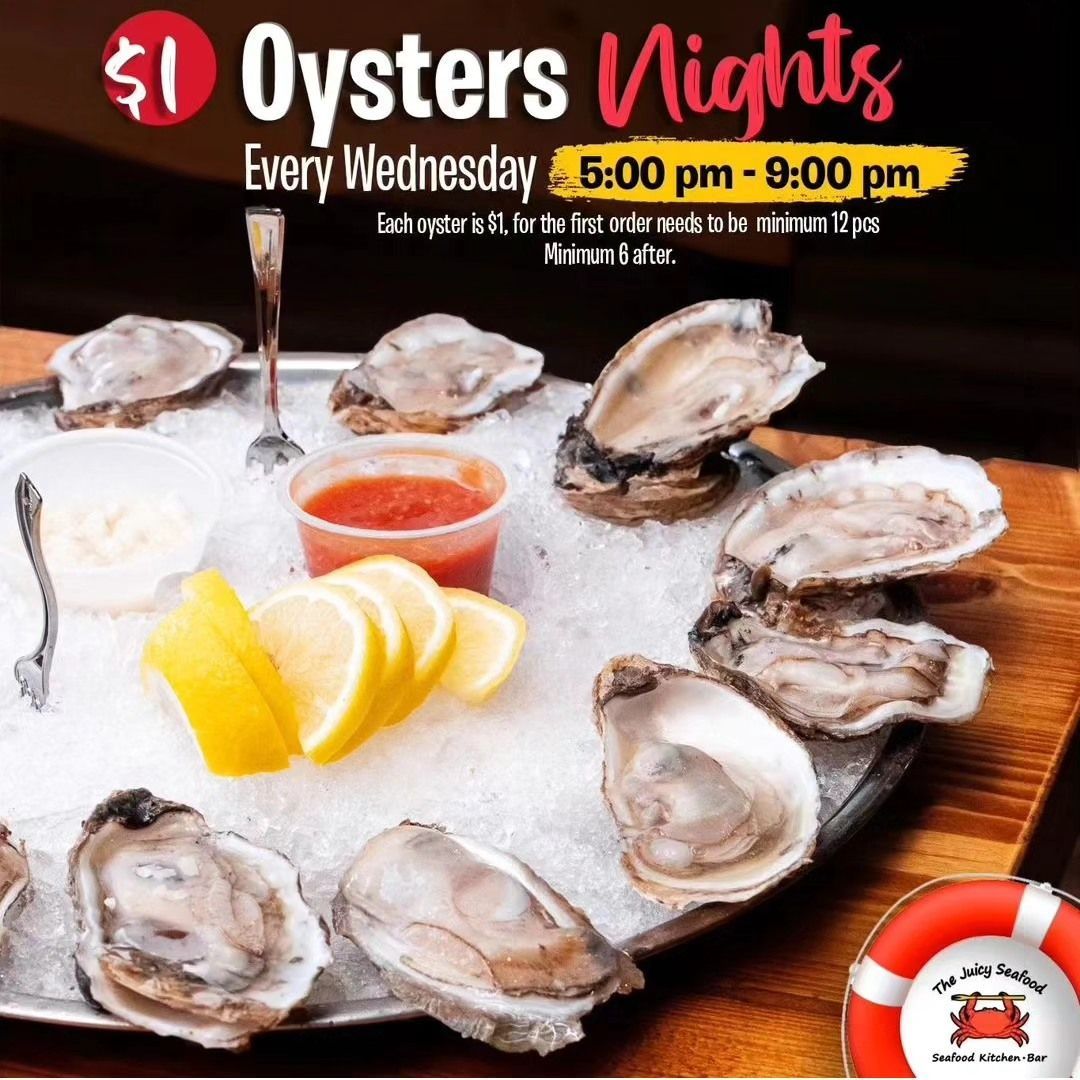 A tray of oysters on ice with lemon slices and dipping sauce