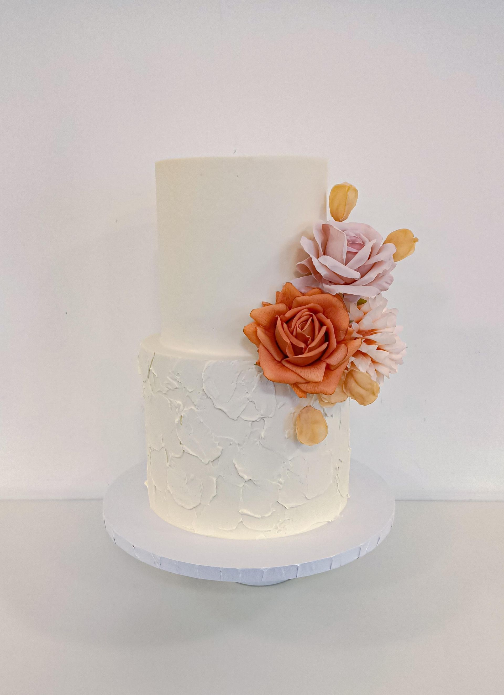Simple two tier white wedding cake with flowers Gold Coast