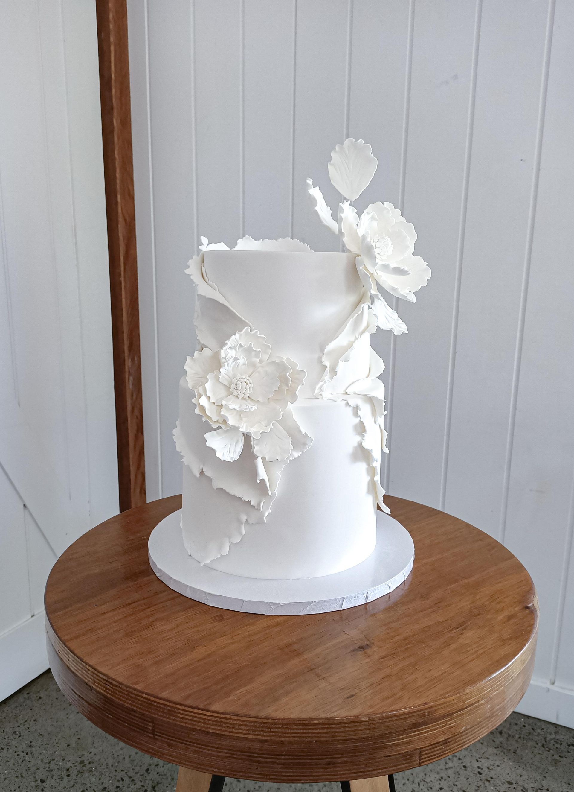 Stunning white fondant wedding caekewith sugar flowers Gold Coast