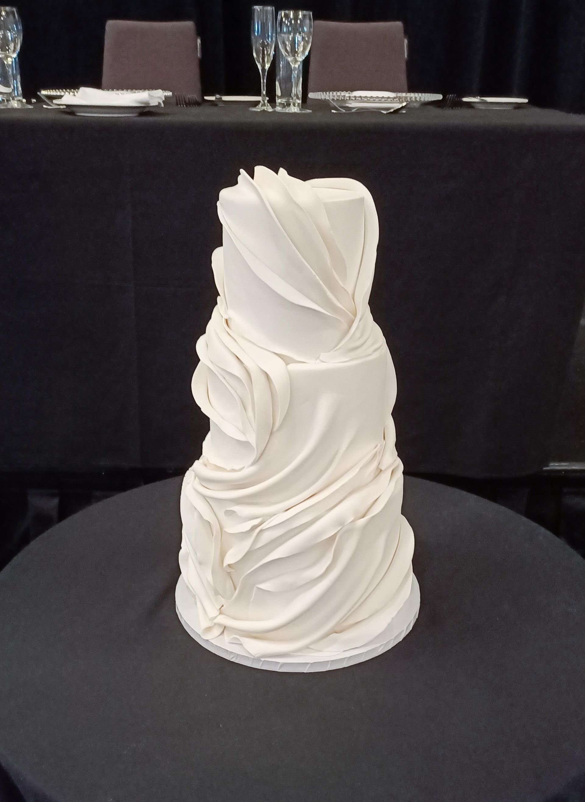 White fondant draped wedding cake Gold Coast