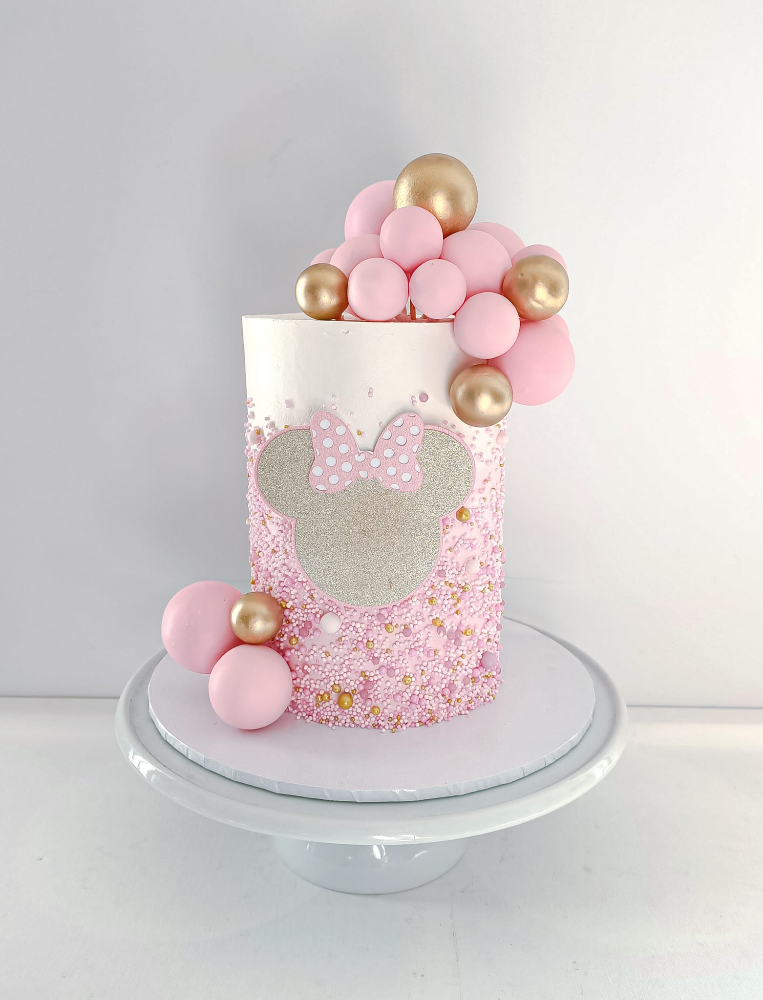 Pink and gold Minnie Mouse themed kids birthday cake on the Gold Coast