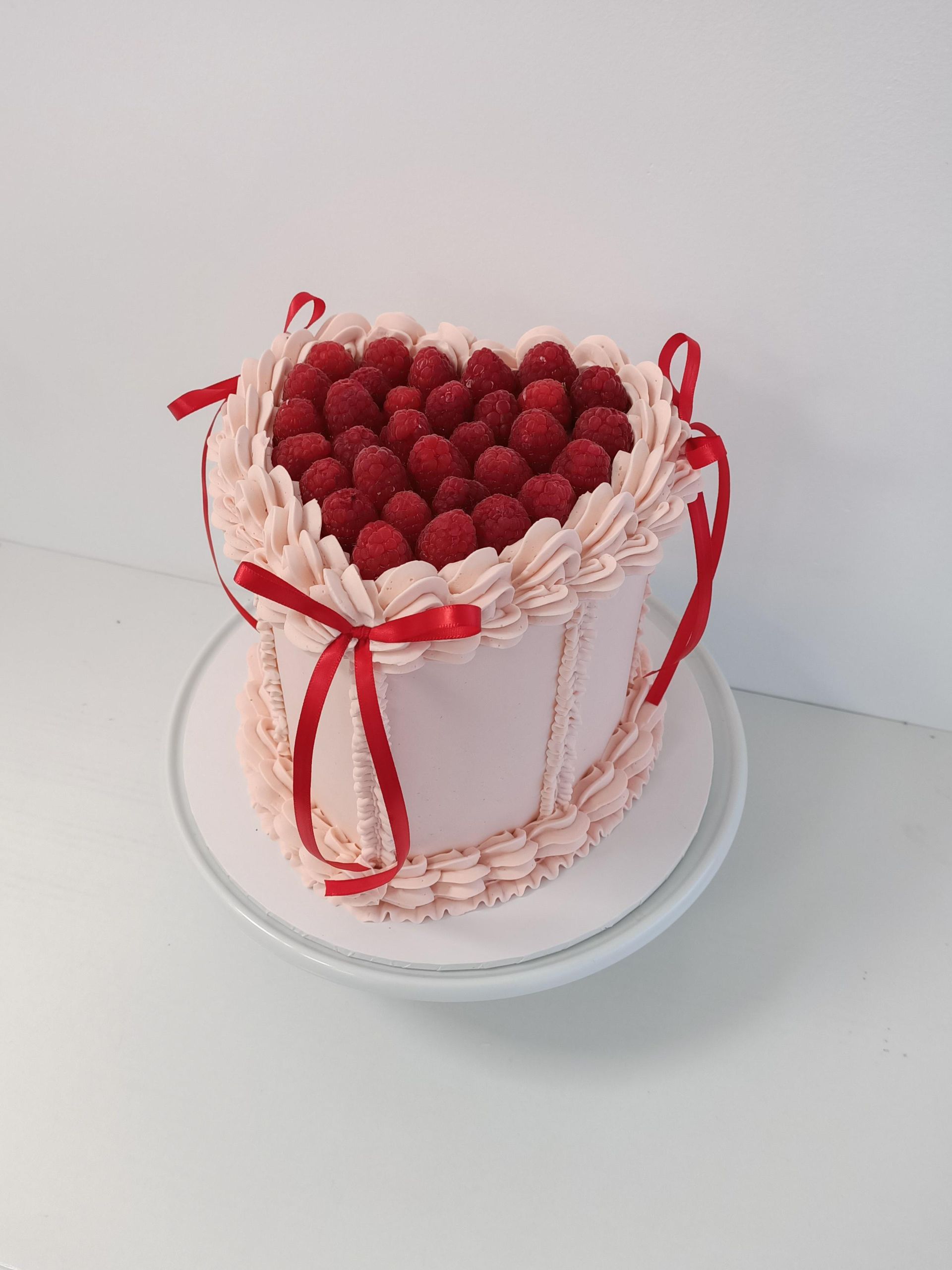 Retro heart cake topped with fresh berries and bows Gold Coast
