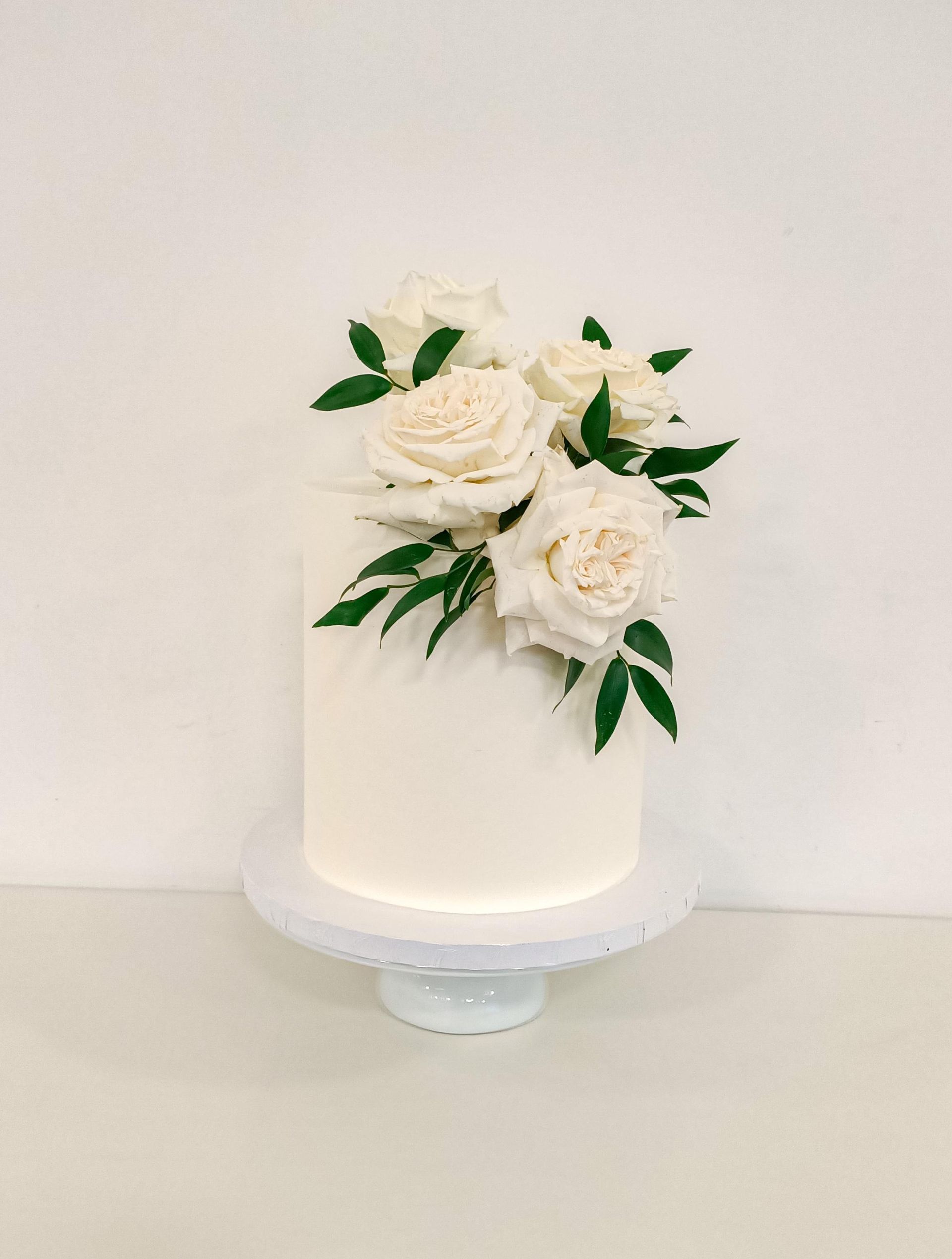 Elegant white wedding cake with flowers Gold Coast