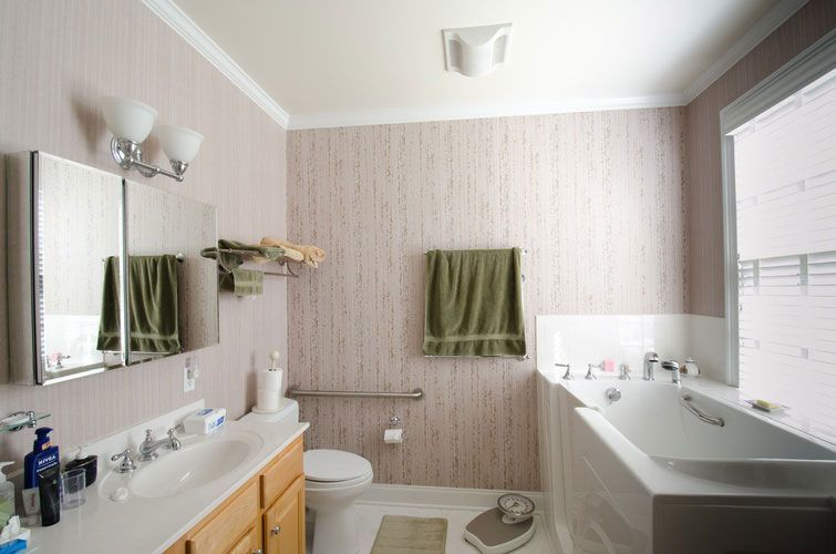 A bathroom with a toilet a sink and a bathtub