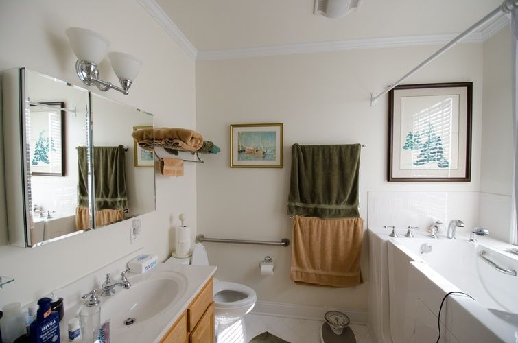 A bathroom with a toilet a sink and a bathtub