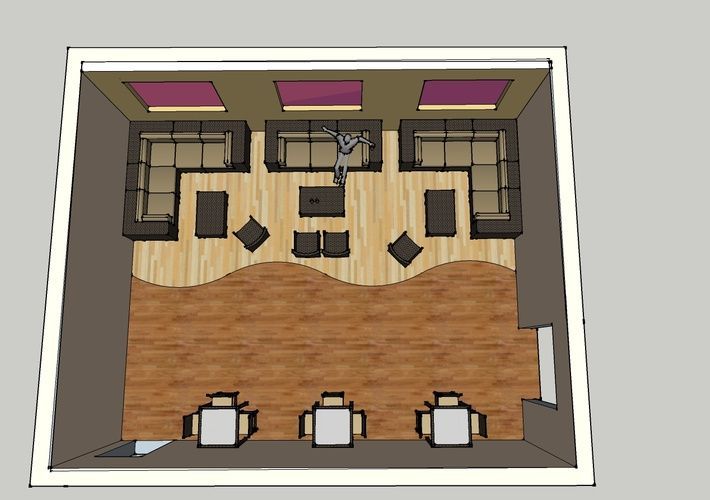 An aerial view of a living room with a couch and chairs