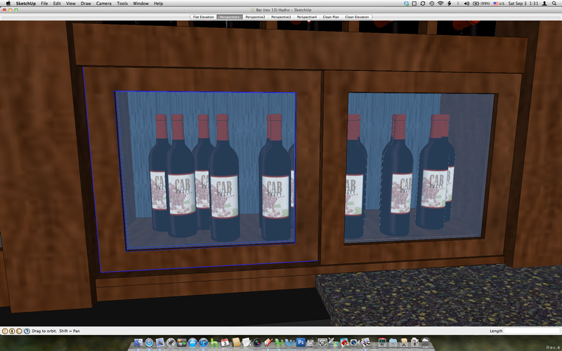 A computer screen shows bottles of wine behind a glass door