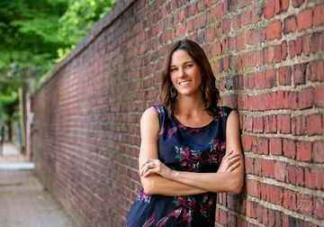 Stephanie Case Leaning on the Wall