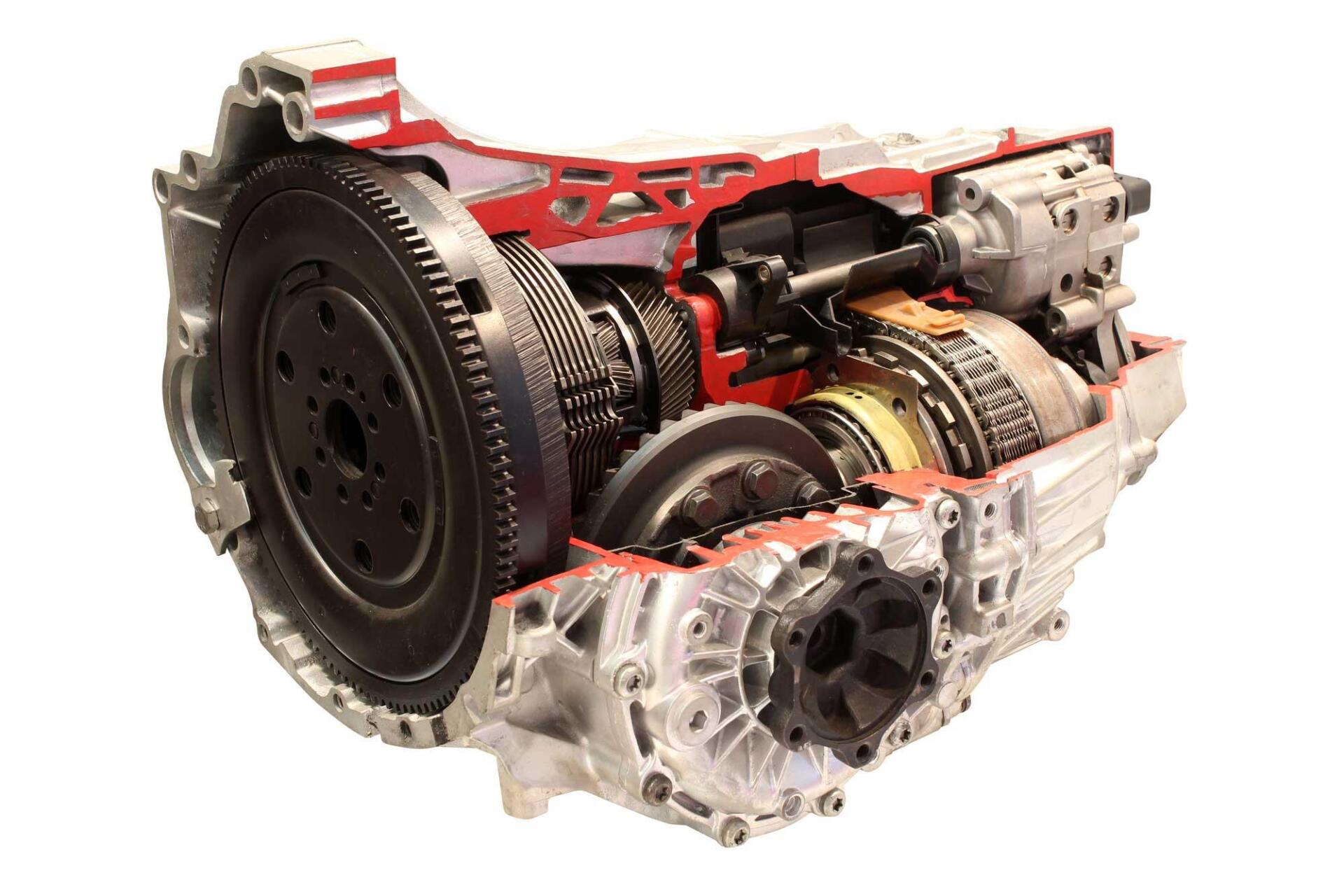 Cutaway of an automatic transmission, showing gears and internal components in silver and red.