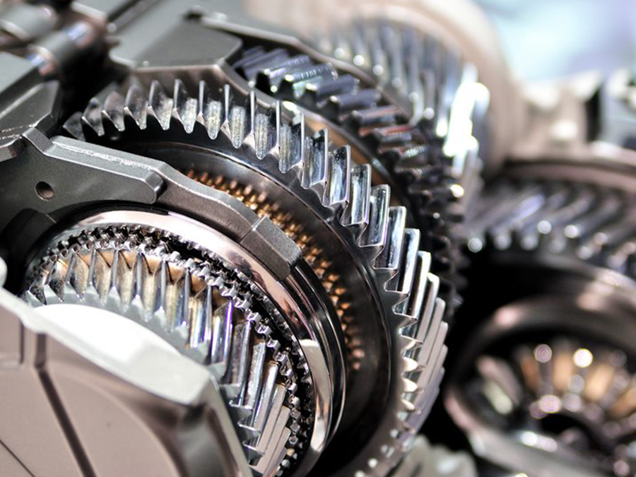 Close-up of interlocking metal gears and cogs in a mechanical assembly
