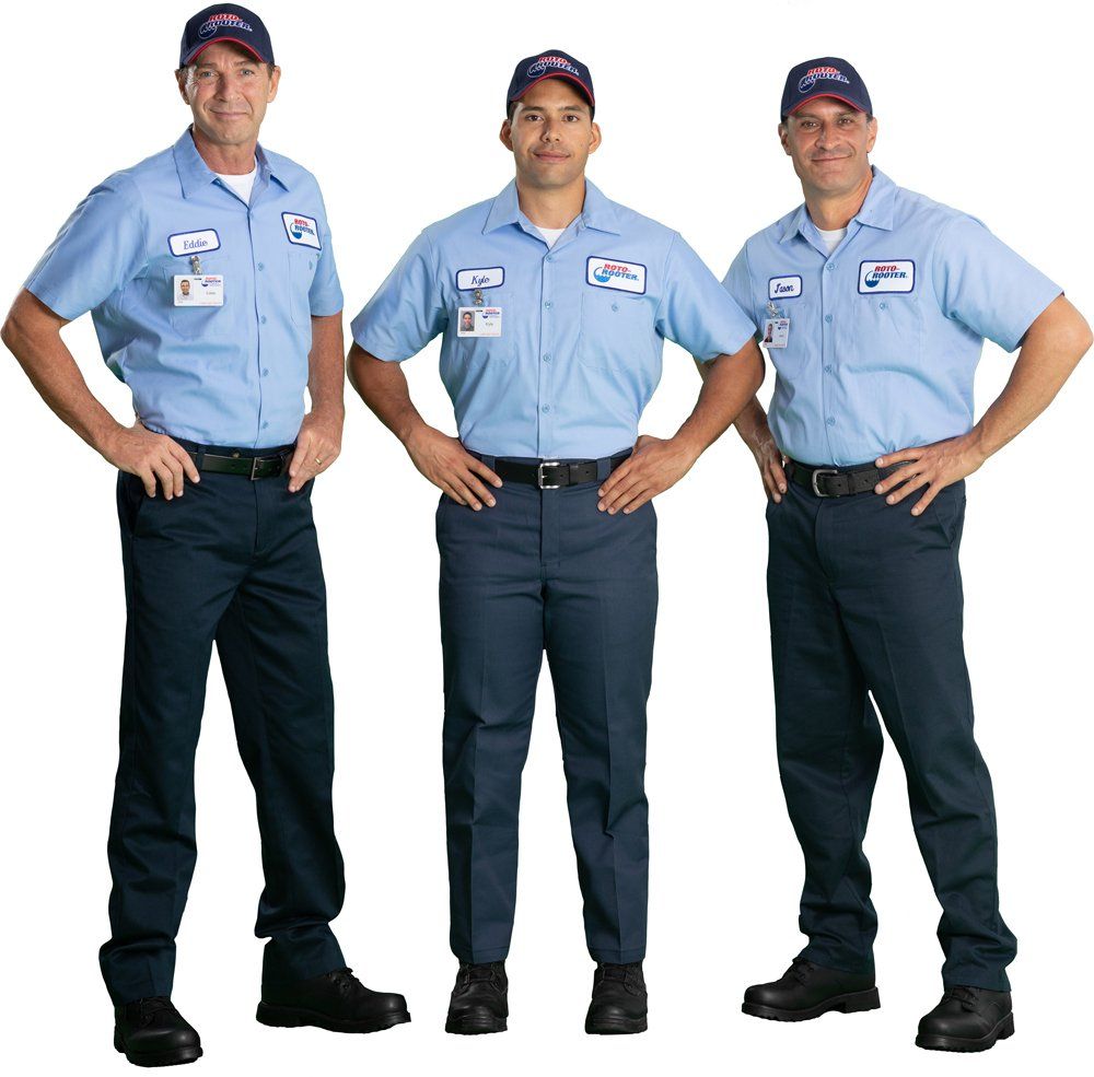 Three men standing next to each other with their hands on their hips