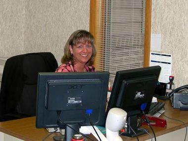 Assistant at desk — Kalamazoo, MI — Roto-Rooter of Southwest Michigan Assistant at desk — Kalamazoo, MI — Roto-Rooter of Southwest Michigan