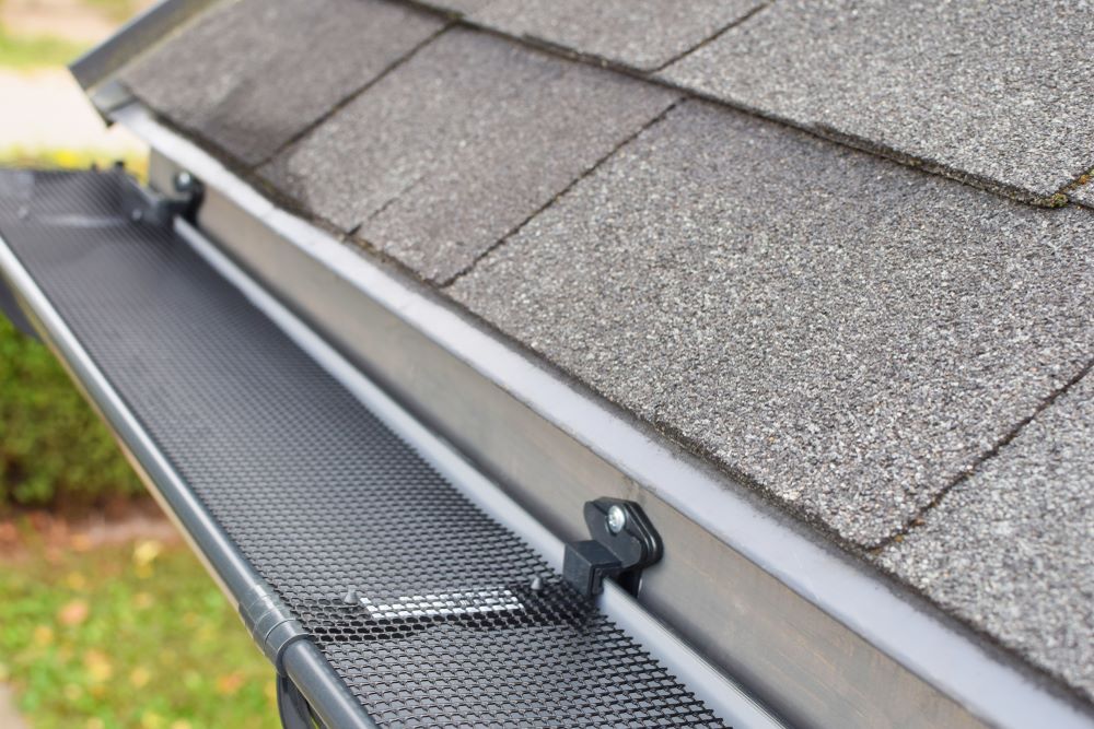 A Close up Of a Gutter on A Roof of A House — Coffs Coast Plumbing in Korora, NSW