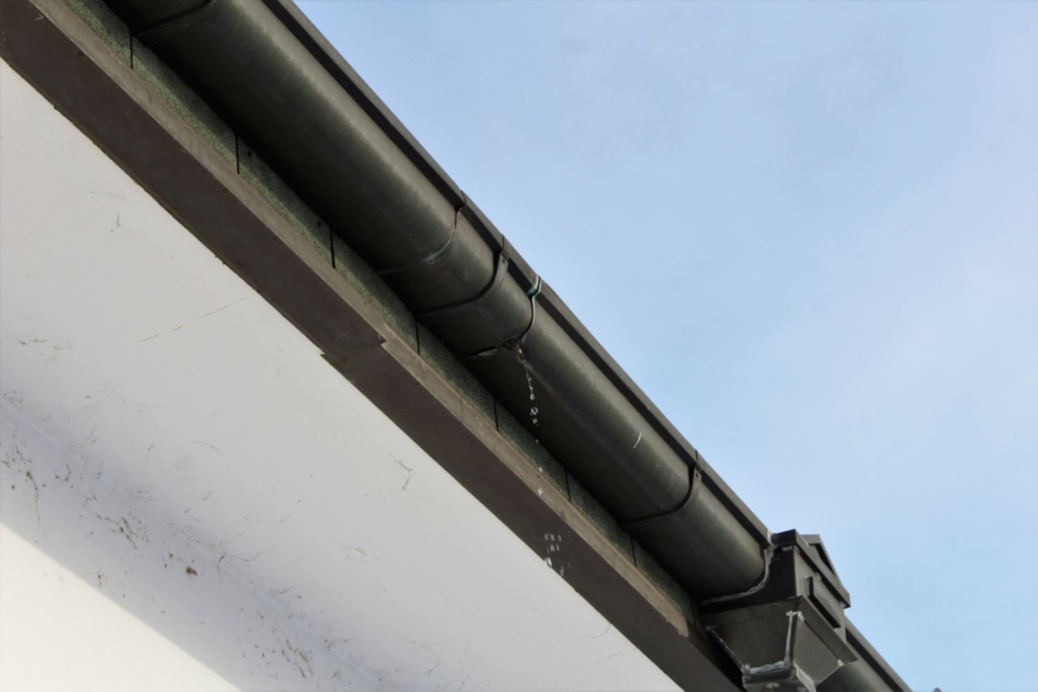 A Close up Of a Gutter on The Side of A Building — Coffs Coast Plumbing in Korora, NSW