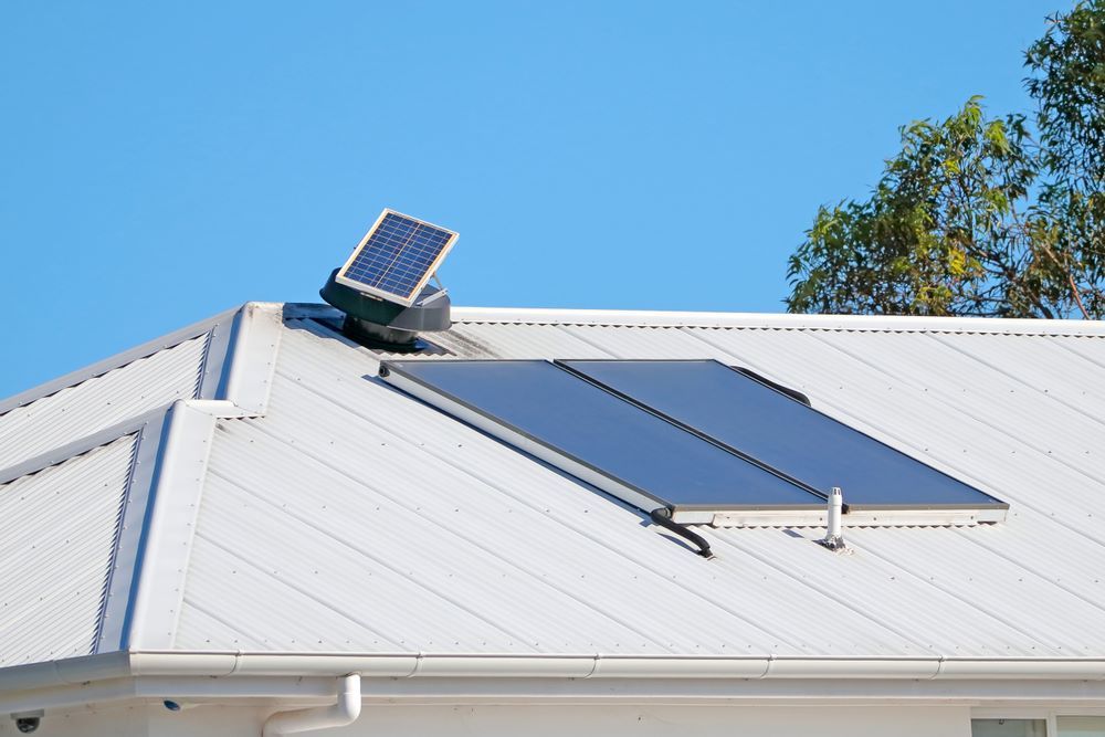 A Solar Panel Is Sitting on Top of A White Roof — Coffs Coast Plumbing in Korora, NSW