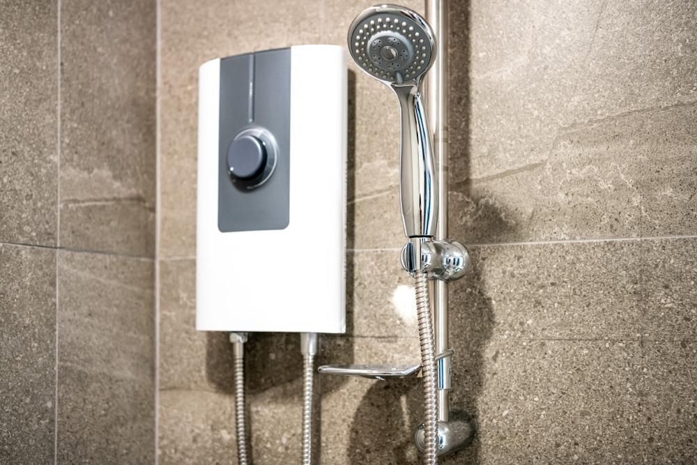 A Shower Head Is Attached to A Wall — Coffs Coast Plumbing in Korora, NSW