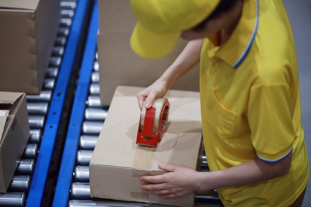 Worker Packaging The Parcel - Farmington Hills, MI - Zoom2Day Deliveries Worker Packaging The Parcel - Farmington Hills, MI - Zoom2Day Deliveries