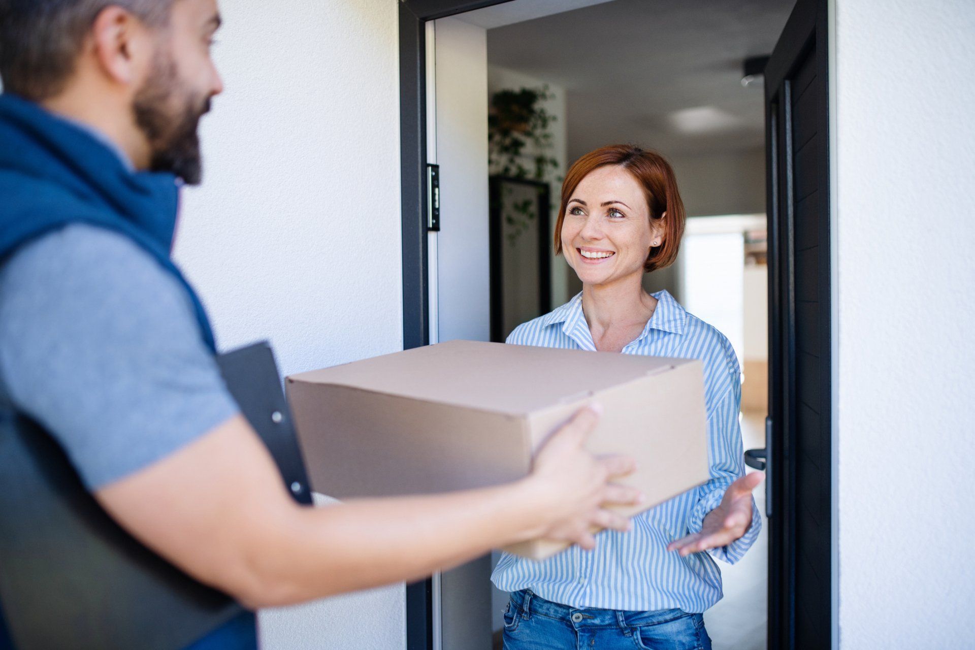 Woman Receive Her Delivery Box - Farmington Hills, MI - Zoom2Day Deliveries